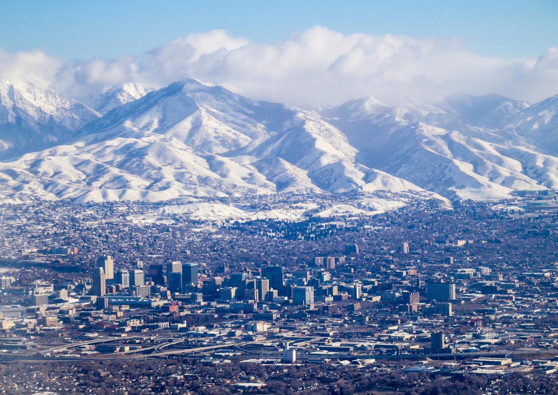 Aerial view of Salt Lake City with snowy mountain landscape in the background