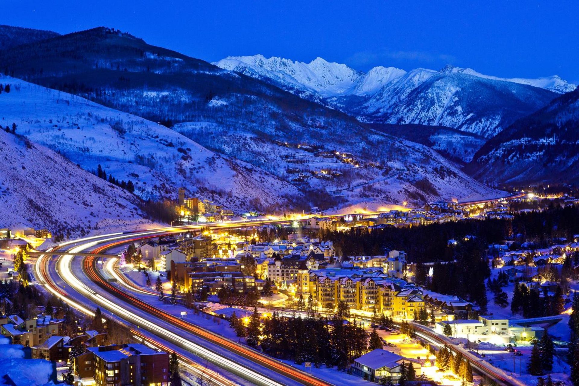 Aerial View of Vail village at night with I-70 Interstate visible and buildings light up